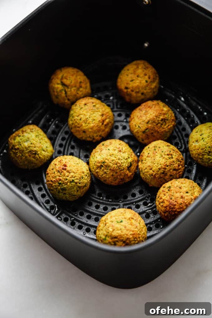 Crispy Air Fryer Falafel Recipe with Tahini Sauce 8 cooked air fryer falafel in an air fryer