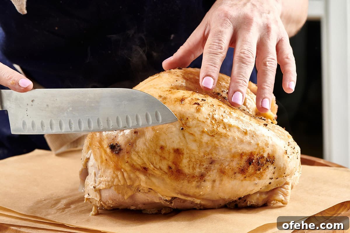 Roast Turkey Breast: Juicy Oven Method and Timing 3 Woman cutting turkey breast with knife on cutting board.