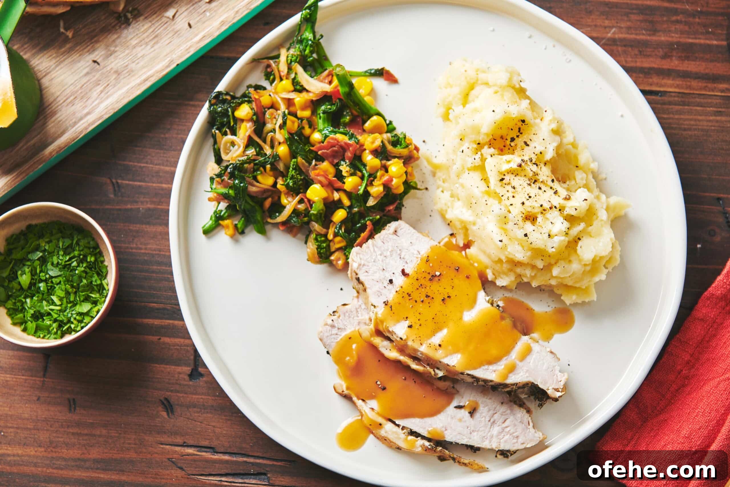 Roast Turkey Breast: Juicy Oven Method and Timing 9 Plate with vegetables, mashed potatoes, and slices of Turkey Breast with gravy.