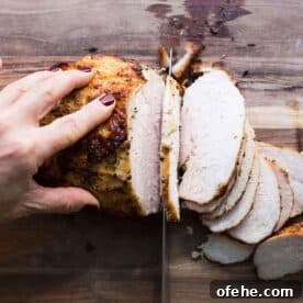 Roast Turkey Breast: Juicy Oven Method and Timing 5 Slicing Lemon-Garlic Roasted Turkey Breast on cutting board.