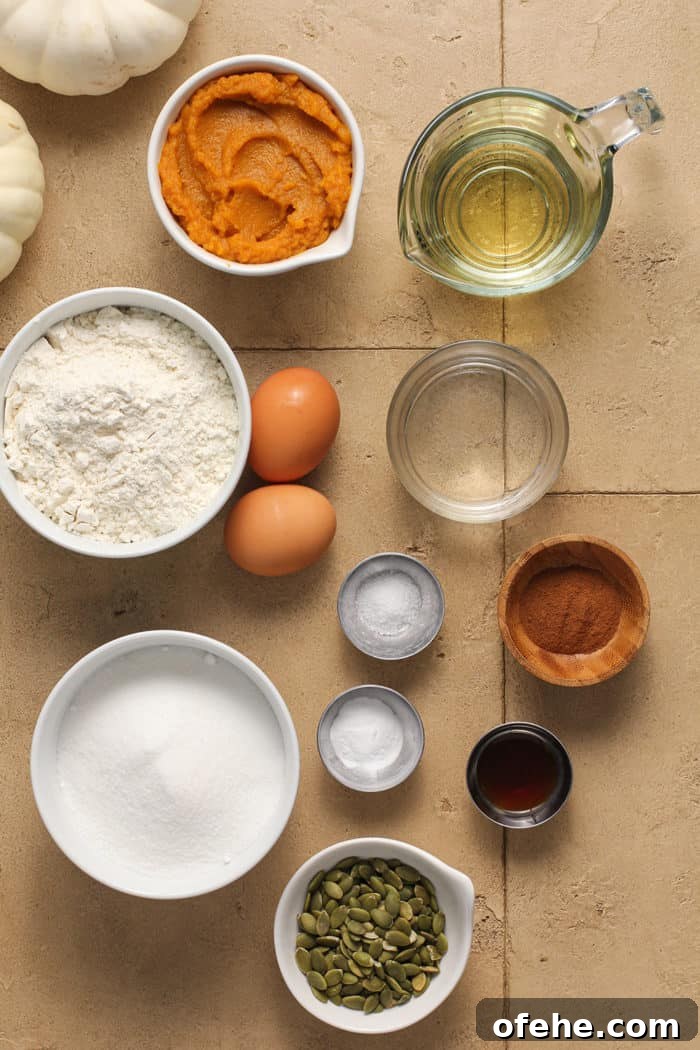 Moist Pumpkin Muffins with Warm Spices Recipe 3 Pumpkin muffin ingredients arranged on a tile counter