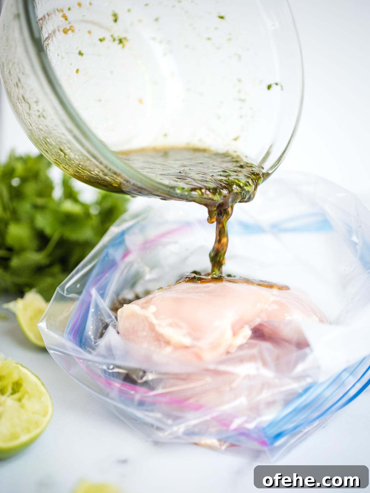 Honey Cilantro Lime Chicken Marinade Recipe for Grilled Chicken 5 marinade being poured into bag of raw chicken