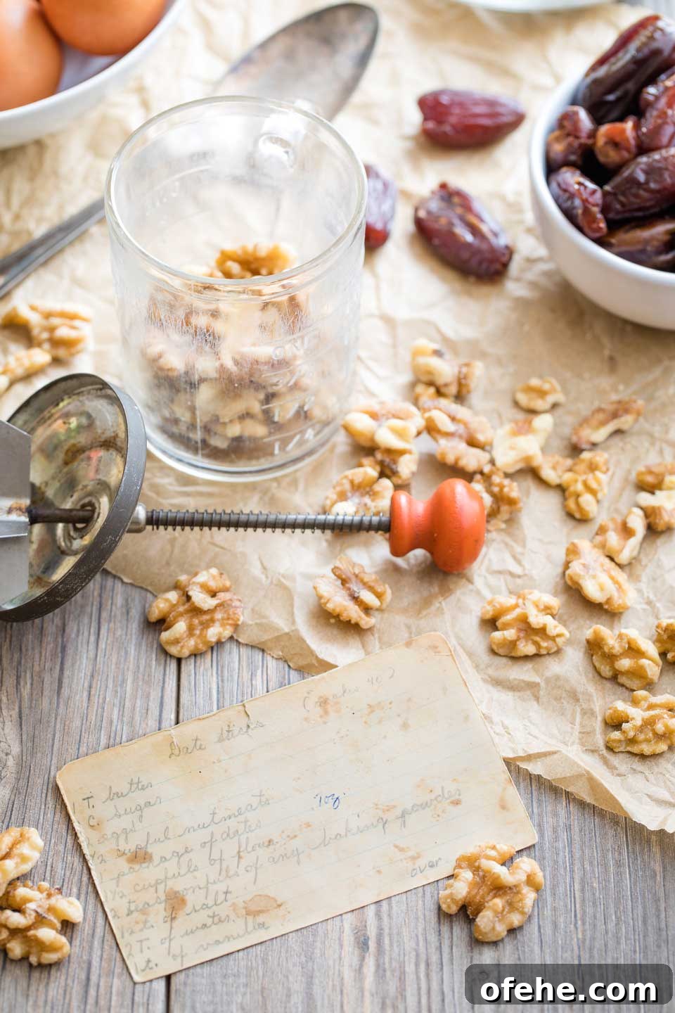 Photo of my mother's original, handwritten recipe card, surrounded by ingredients for the recipe.