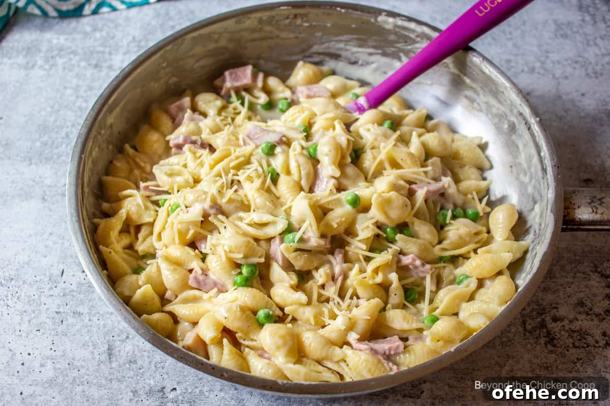 Creamy Ham and Pea Pasta Recipe for Quick Weeknight Dinners 5 A pasta dish with ham and peas.