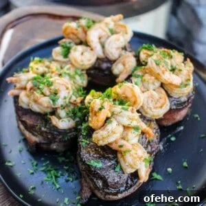 Top Surf and Turf Recipes for Dinner: Steak and Seafood Ideas 13 Bacon Wrapped Filet Mignon with Garlic Shrimp.