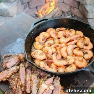 Top Surf and Turf Recipes for Dinner: Steak and Seafood Ideas 16 Chili Butter Steak and Shrimp plated and served.