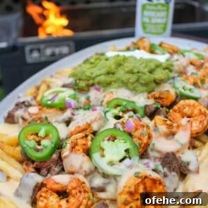 Top Surf and Turf Recipes for Dinner: Steak and Seafood Ideas 29 Loaded Steak Fries with Shrimp.