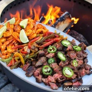 Top Surf and Turf Recipes for Dinner: Steak and Seafood Ideas 6 Surf and Turf Fajitas plated and ready to serve.