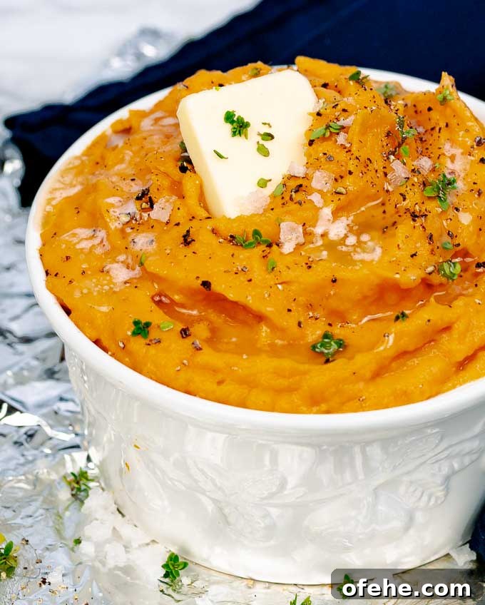 Savory Roasted Sweet Potato Mash with Garlic and Herbs 2 left side of white bowl of Roasted Savory Mashed Sweet Potatoes Recipe