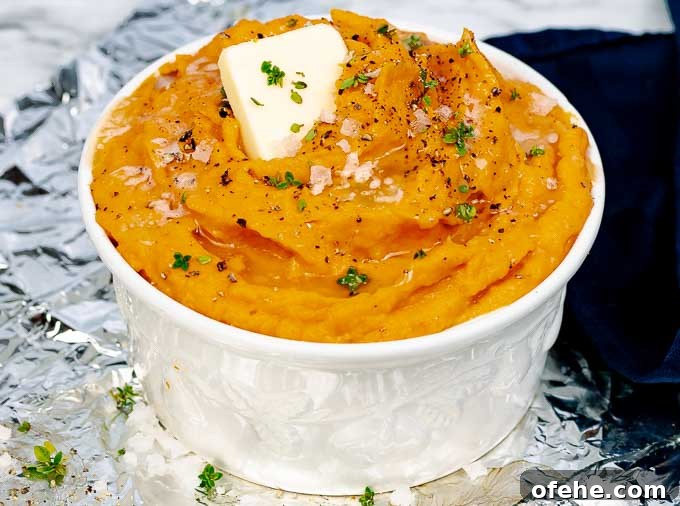 Savory Roasted Sweet Potato Mash with Garlic and Herbs 3 white bowl of Roasted Savory Mashed Sweet Potatoes and blue napkin