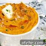 right side of white bowl of Roasted Savory Mashed Sweet Potatoes