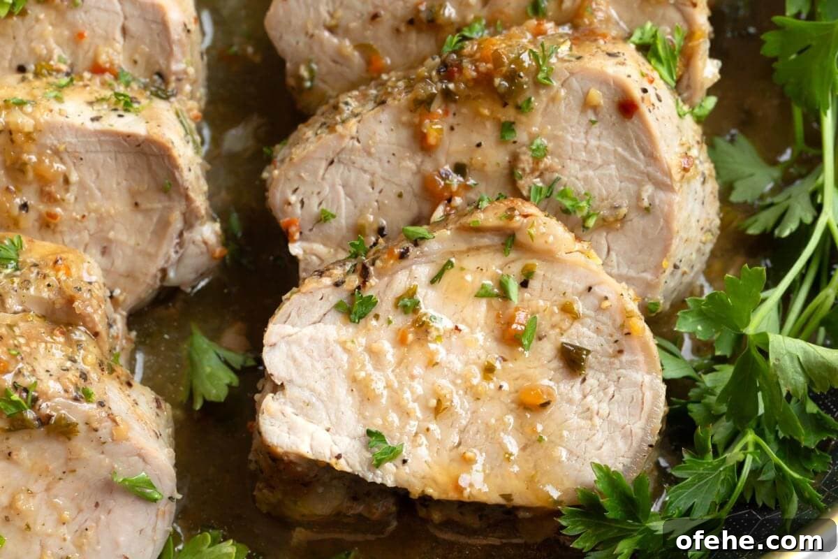 Juicy Oven-Roasted Pork Tenderloin Recipe 3 closeup of Pork Tenderloin slices