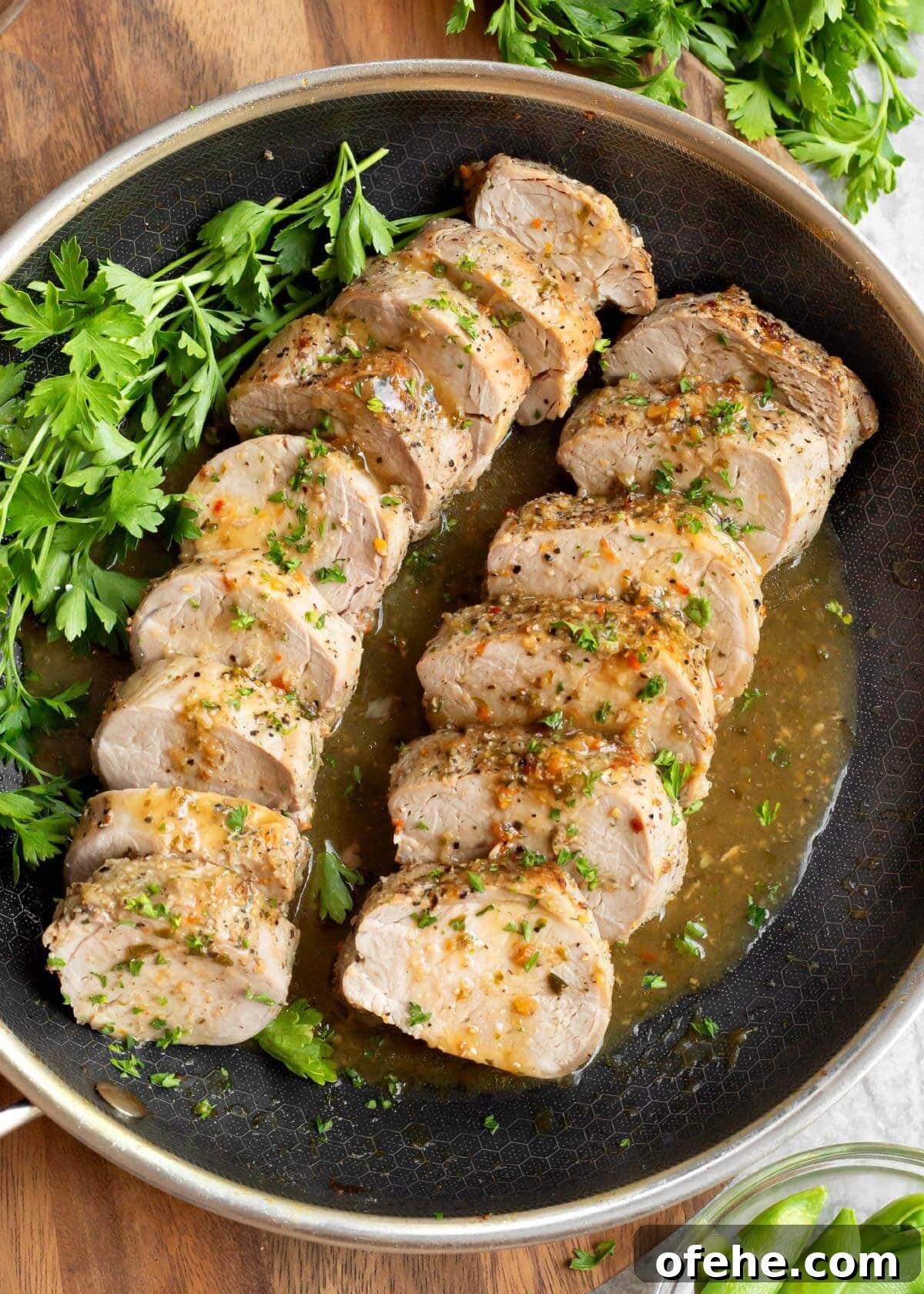 Juicy Oven-Roasted Pork Tenderloin Recipe 10 2 Easy Baked Pork Tenderloin sliced in a skillet