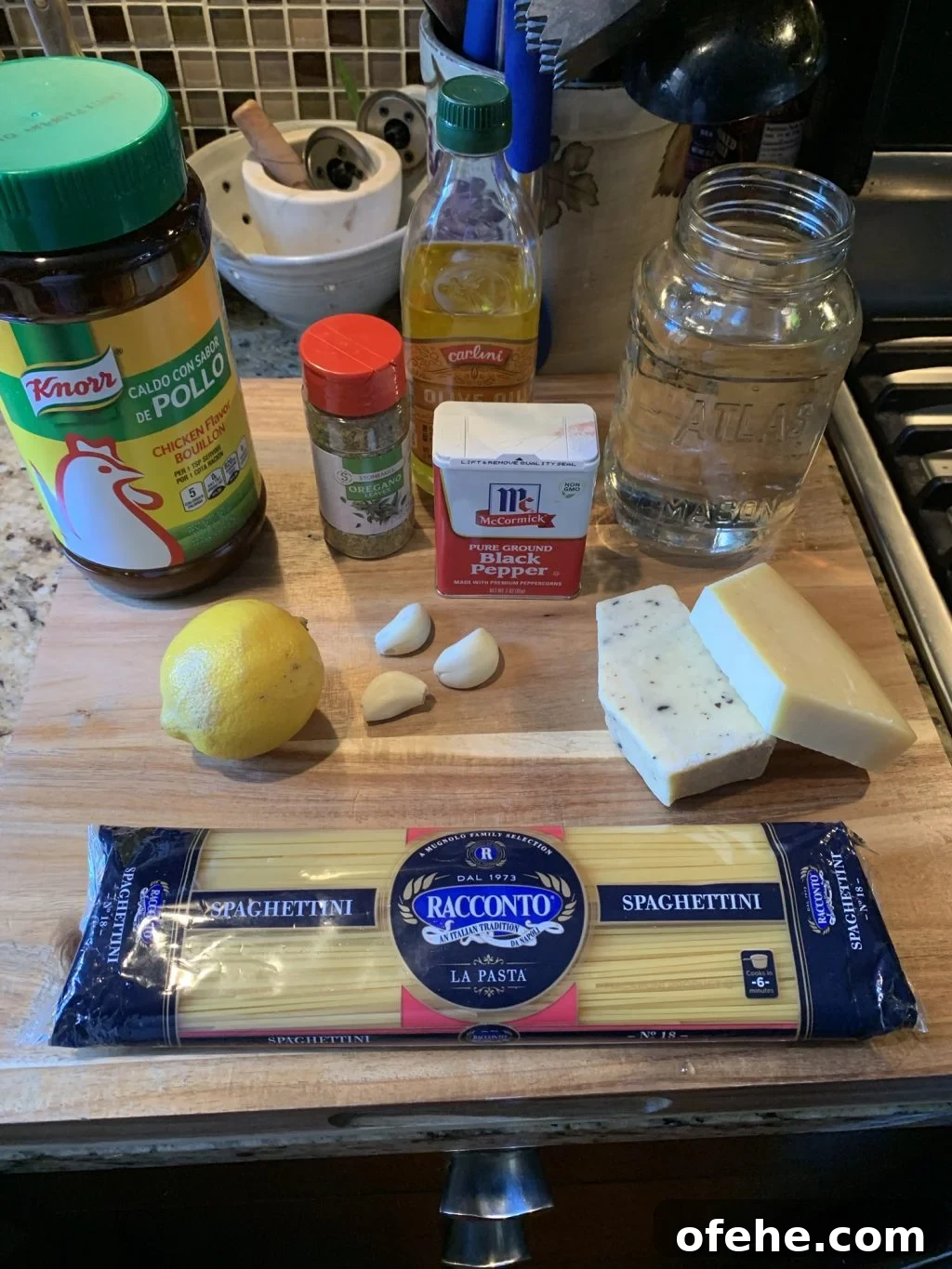Garlic Lemon Spaghetti Made in the Instant Pot: Quick One-Pot Recipe 3 The ingredients for the spaghetti including lemon, garlic, black pepper, cheese, and olive oil