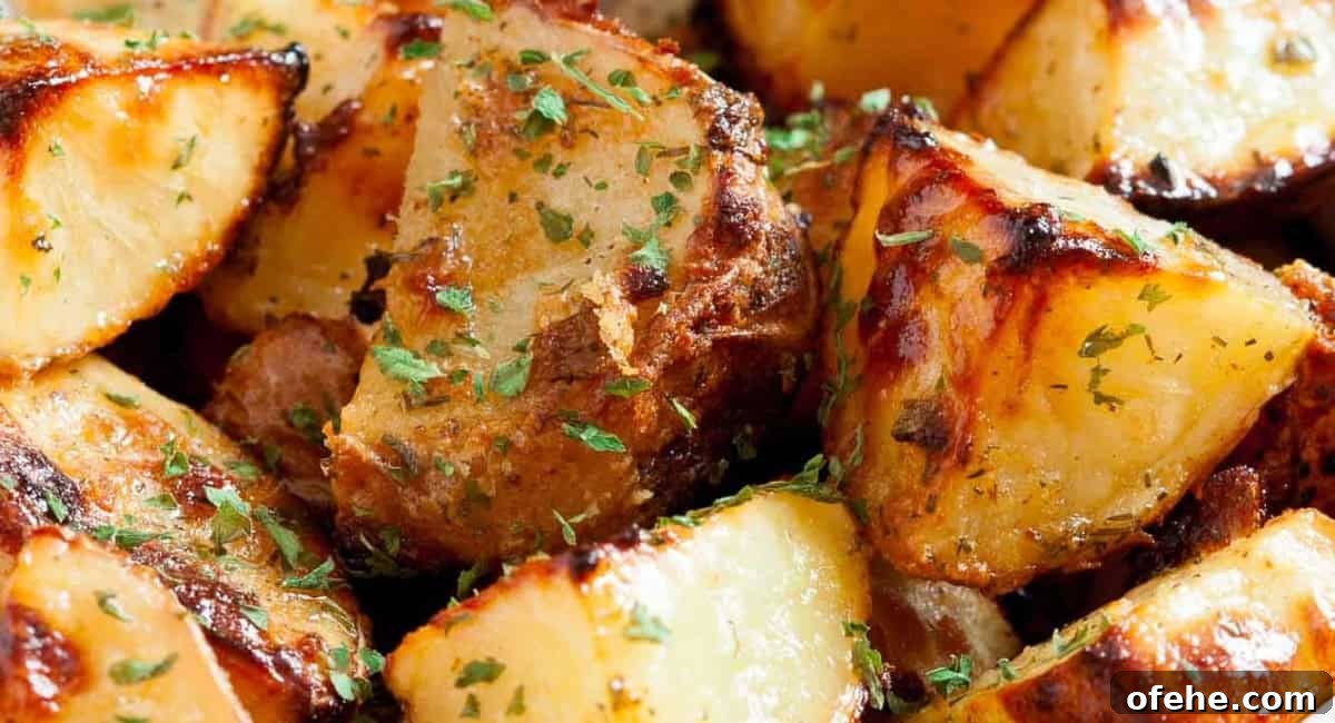 Up close image of ranch roasted potatoes with garnish.
