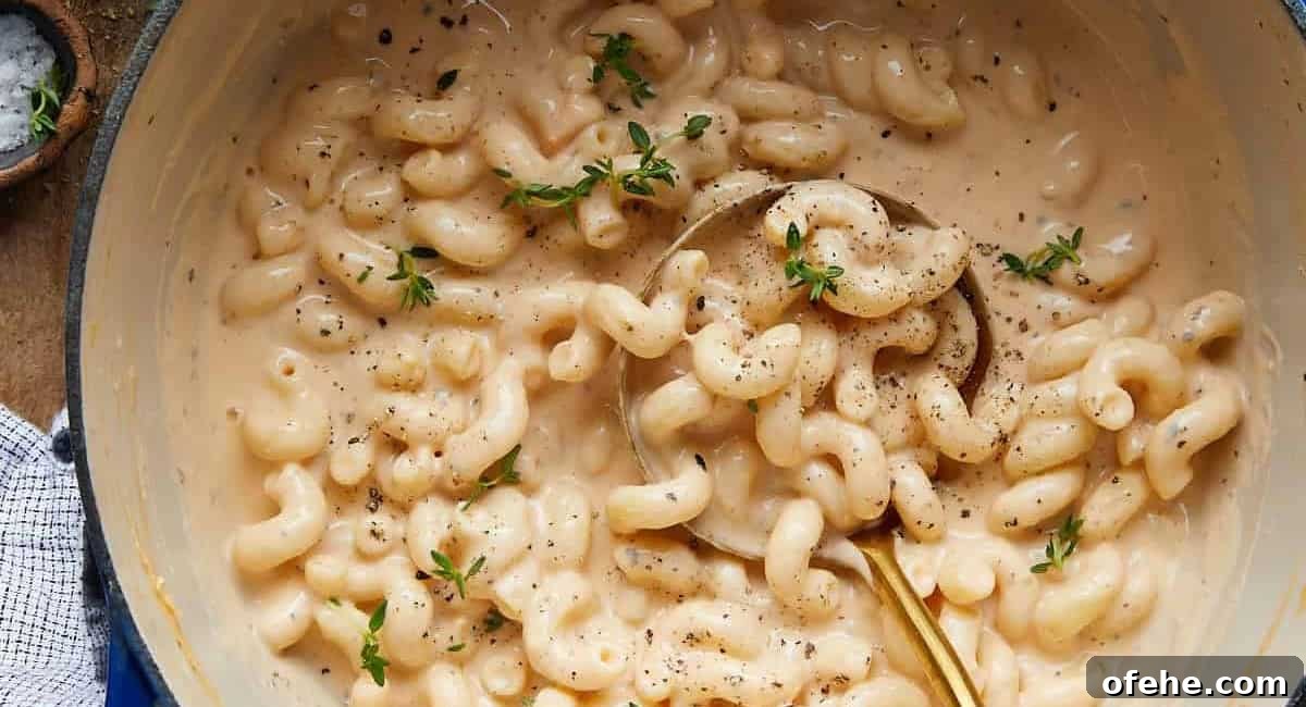 Overhead image of dutch oven mac and cheese with garnish.