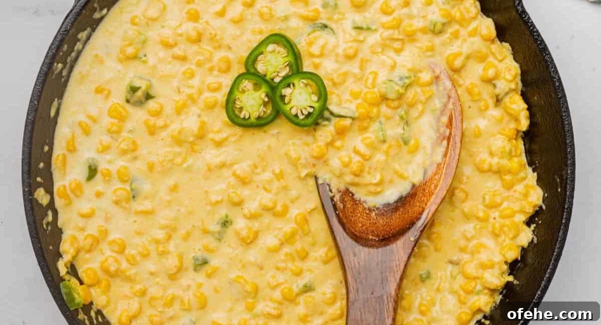 Overhead image of spicy jalapeno creamed corn with jalapeno garnish.