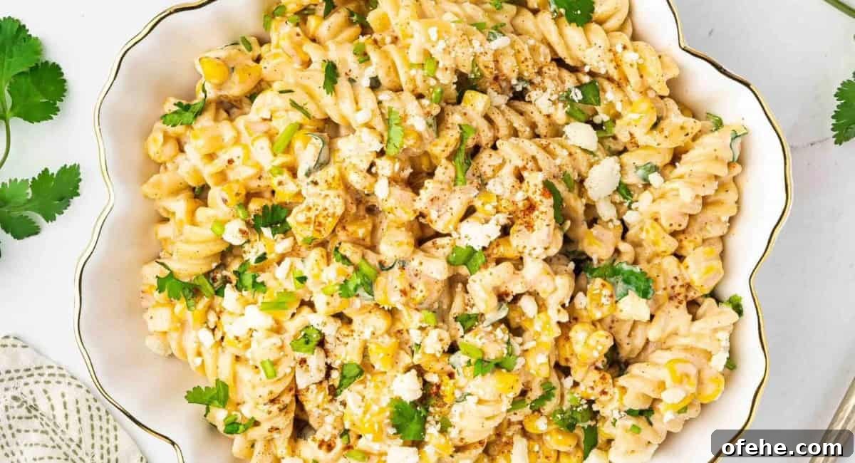 Overhead image of Mexican street corn pasta salad with garnish.