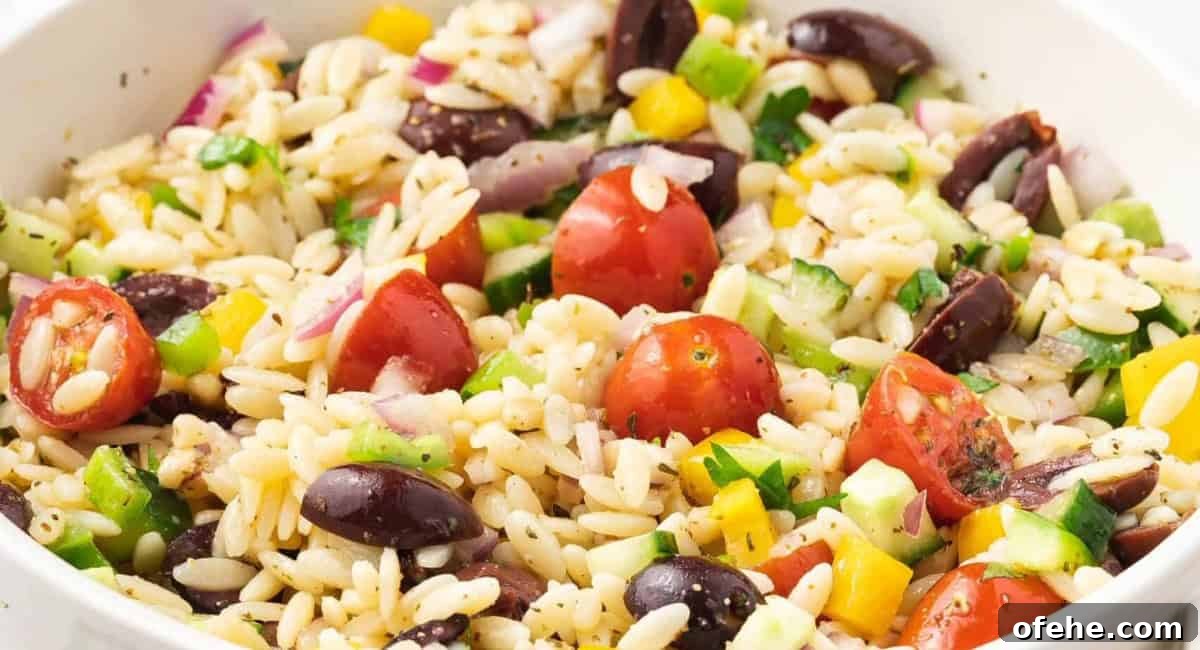 Up close image of orzo pasta salad with honey dijon dressing.