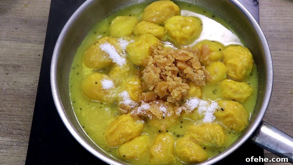 mangoes and jaggery added to mango sasav.