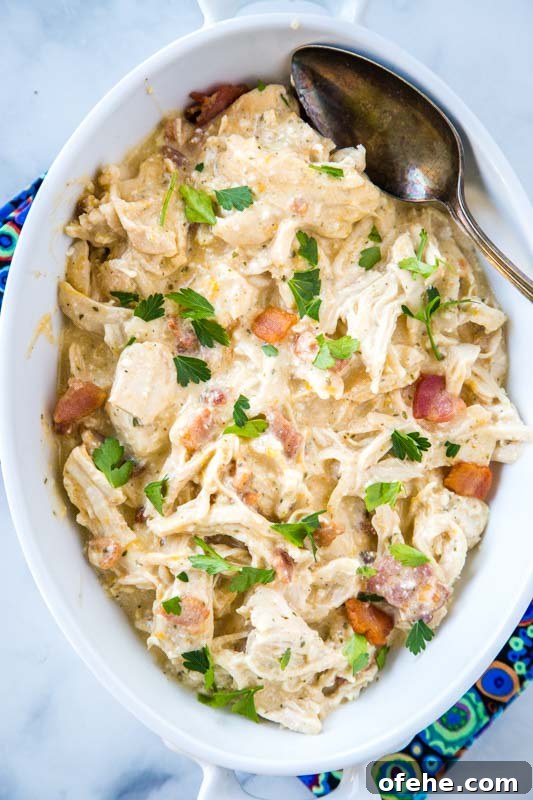 Irresistible Instant Pot Crack Chicken Recipe for Weeknights 5 Shredded chicken with cream cheese, ranch mix, bacon, and cheese