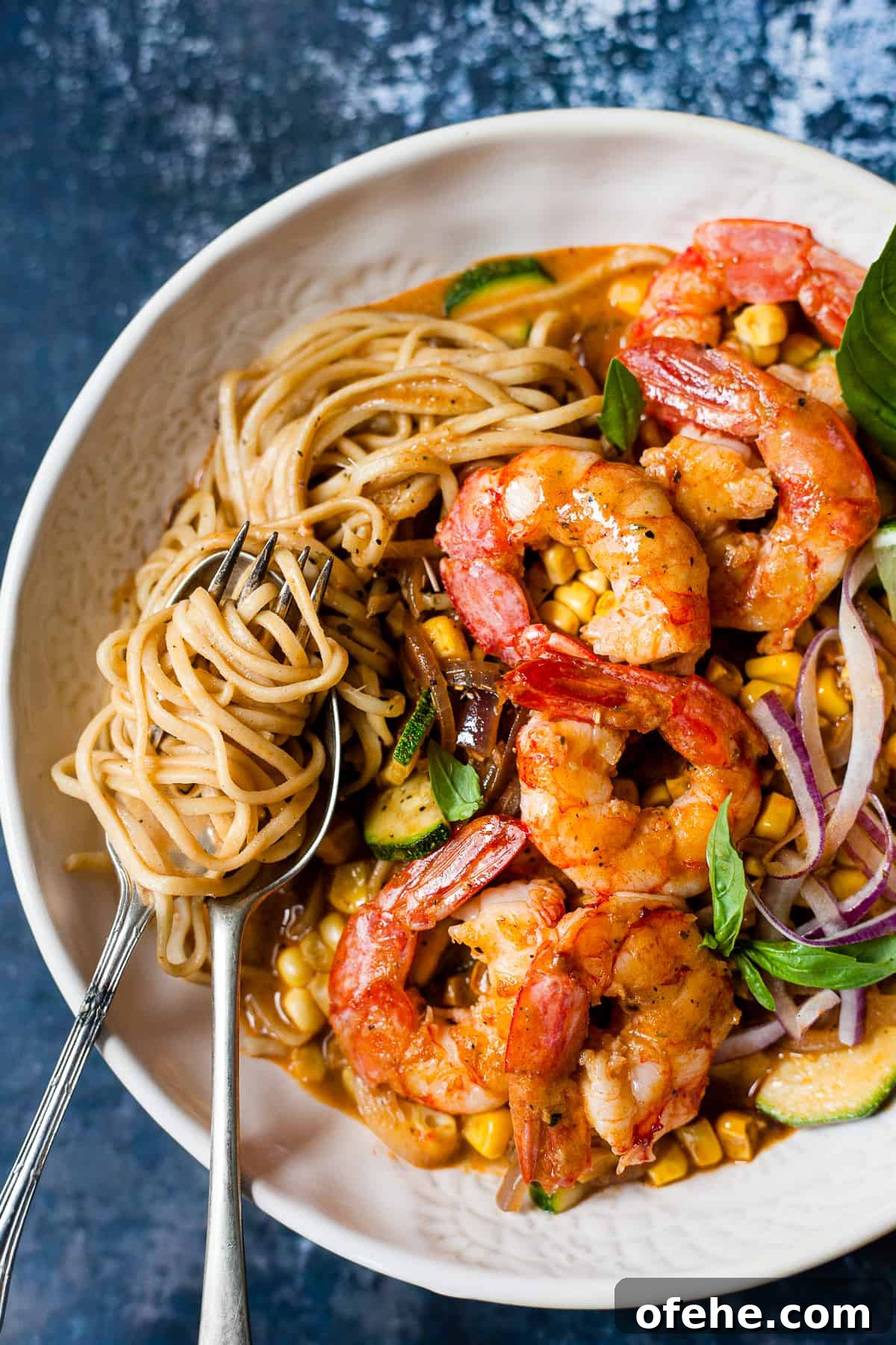 30-Minute Red Thai Prawn Curry Recipe for Busy Weeknights 7 Bowl of curry prawns in red Thai curry sauce.