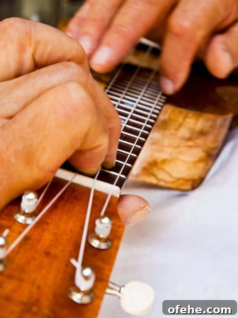 Waikīkī Hawaiian Cultural Activities: Free Events & Experiences 2 Close up of hands strumming a ʻukulele.