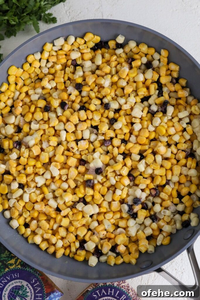 Vegan Elote-Style Corn Salad Recipe for Summer BBQs 3 frozen corn in a pan