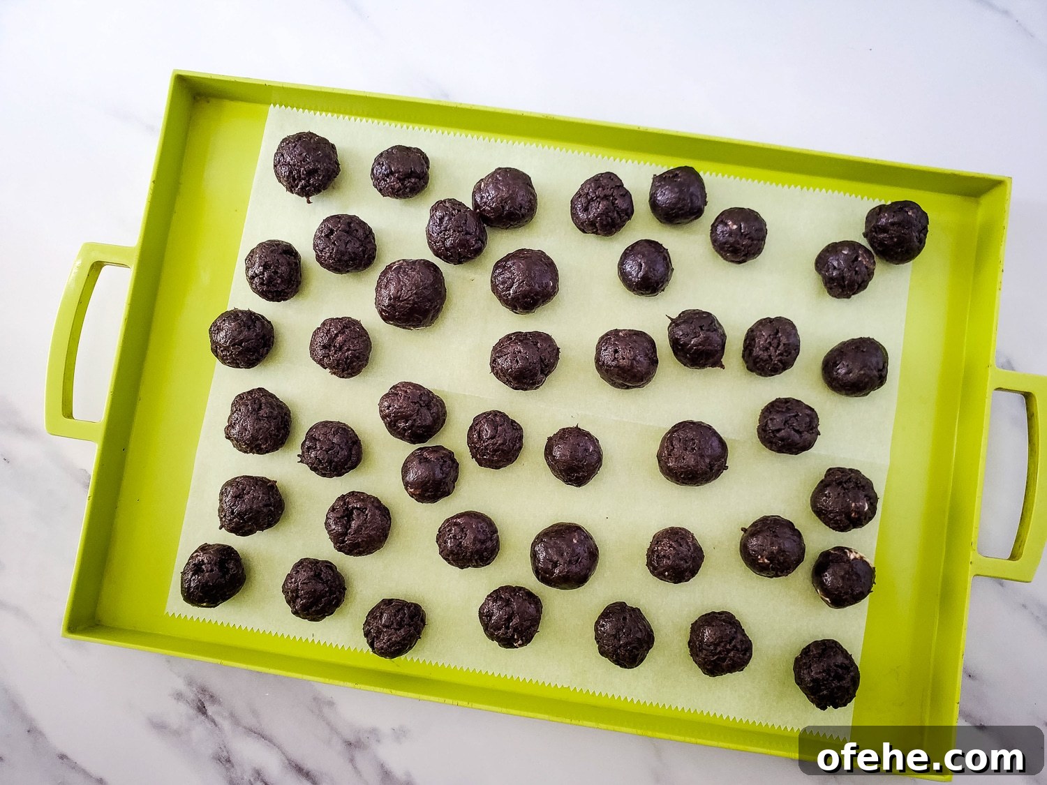 rolling cookie mixture into balls