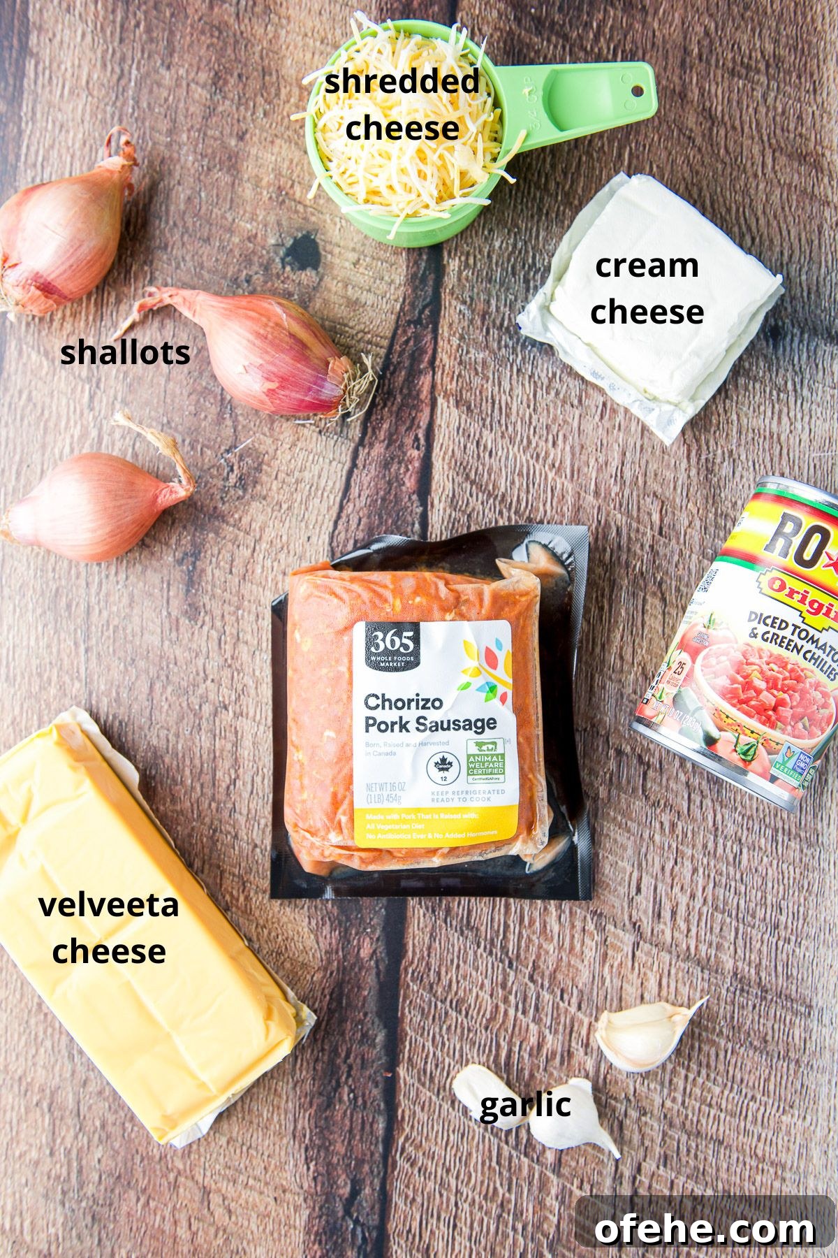 Creamy Chorizo Dip Recipe for Game Day or Parties 4 Chorizo, cheeses, shallots, tomatoes and garlic on a table