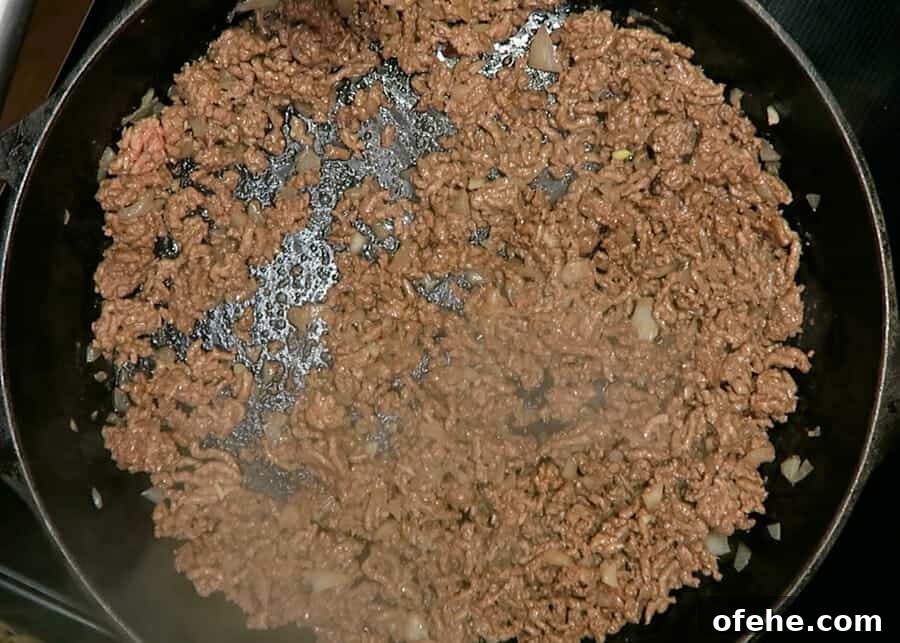 30-Minute Korean Ground Beef Stir-Fry Recipe (One-Pot) 6 ground beef being browned in large cast iron skillet