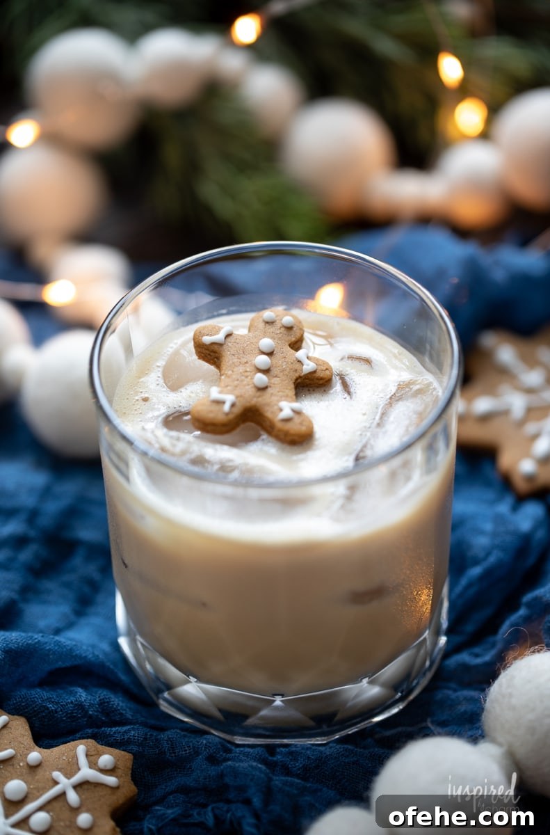 Gingerbread White Russian Cocktail Recipe — Holiday Coffee Liqueur 2 Gingerbread White Russian with gingerbread man garnish.