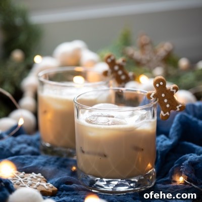 Gingerbread White Russian Cocktail Recipe — Holiday Coffee Liqueur 12 Gingerbread White Russian with gingerbread man garnish.