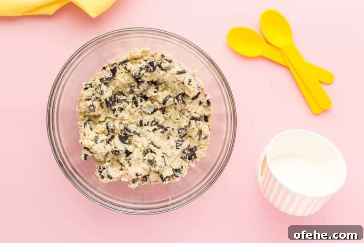 Edible Oreo Cookie Dough Recipe You Can Eat Raw 8 oreo cookie dough in a glass bowl.