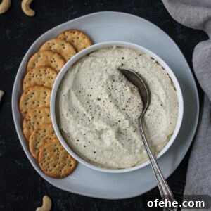 Creamy Vegan Cashew Ricotta Recipe for Pasta & Pizza 9 Vegan ricotta in a serving bowl on a plate with crackers.