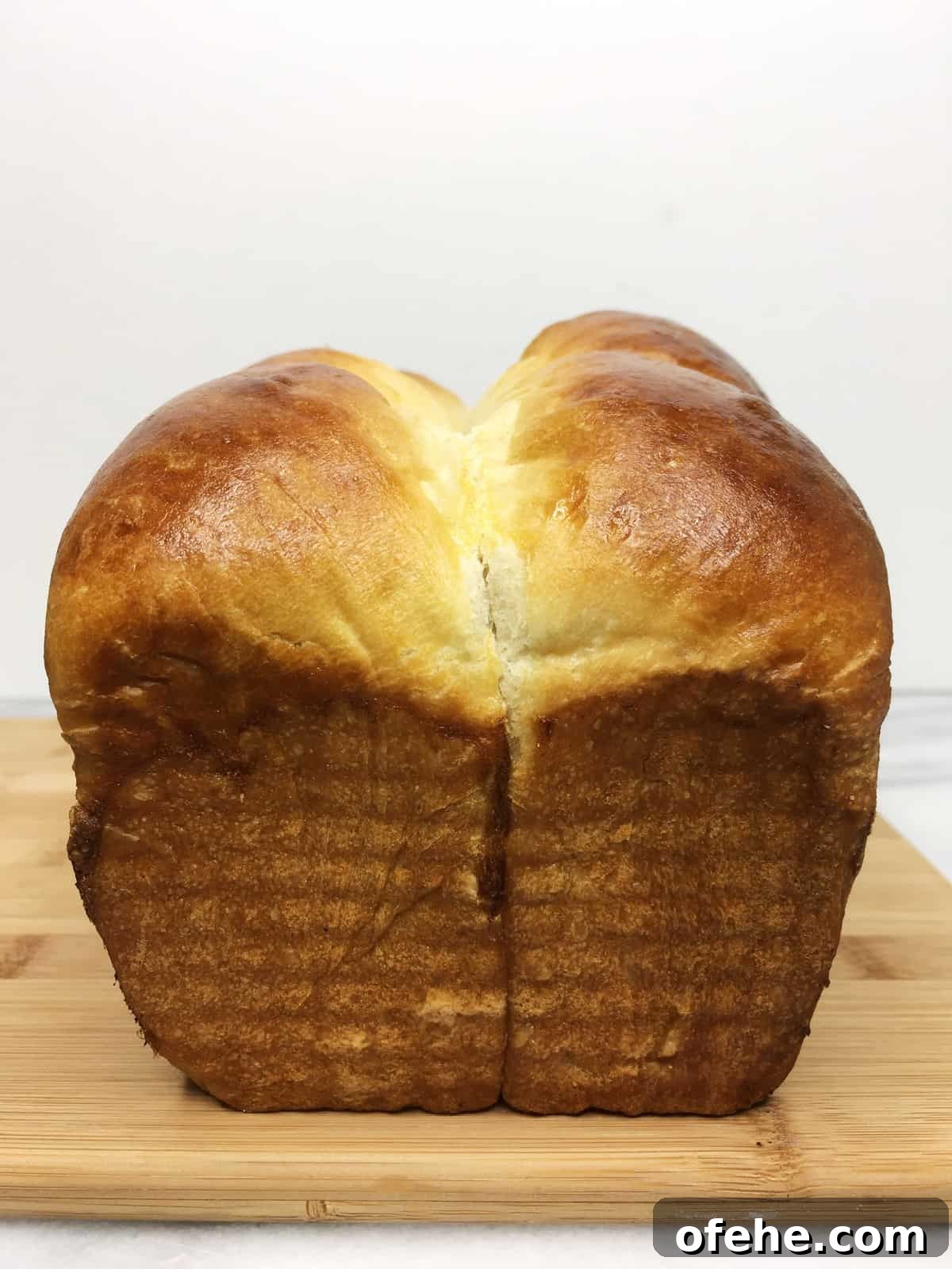 Authentic French Brioche Recipe for Soft, Buttery Loaves 3 Baked brioche loaf on a wooden board