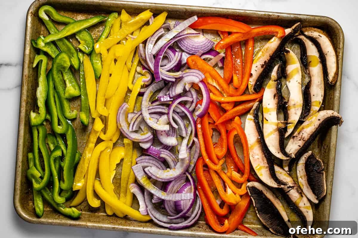 Oven-Baked Fajita Vegetables with Bell Peppers and Onions 4 Baking sheet filled with sliced veggies drizzled with olive oil