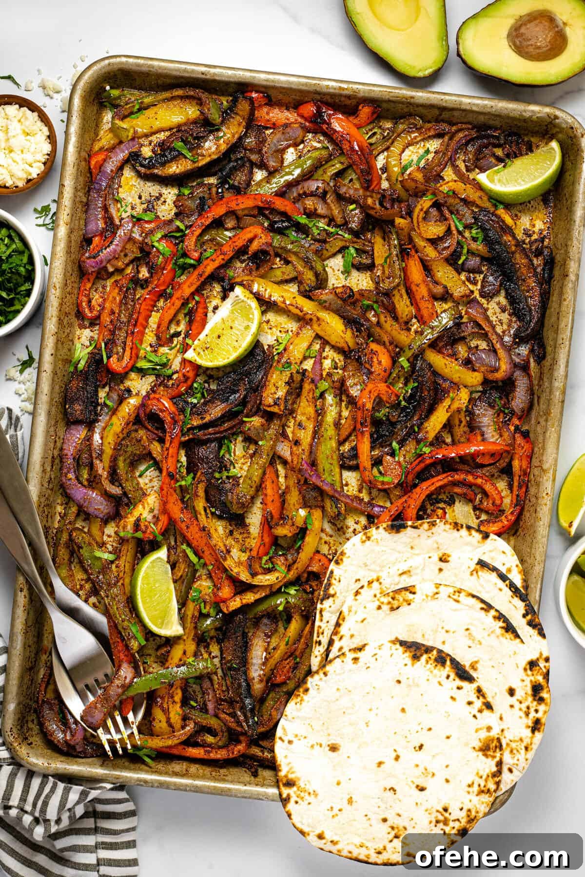 Oven-Baked Fajita Vegetables with Bell Peppers and Onions 8 Baking sheet filled with oven baked fajita veggies