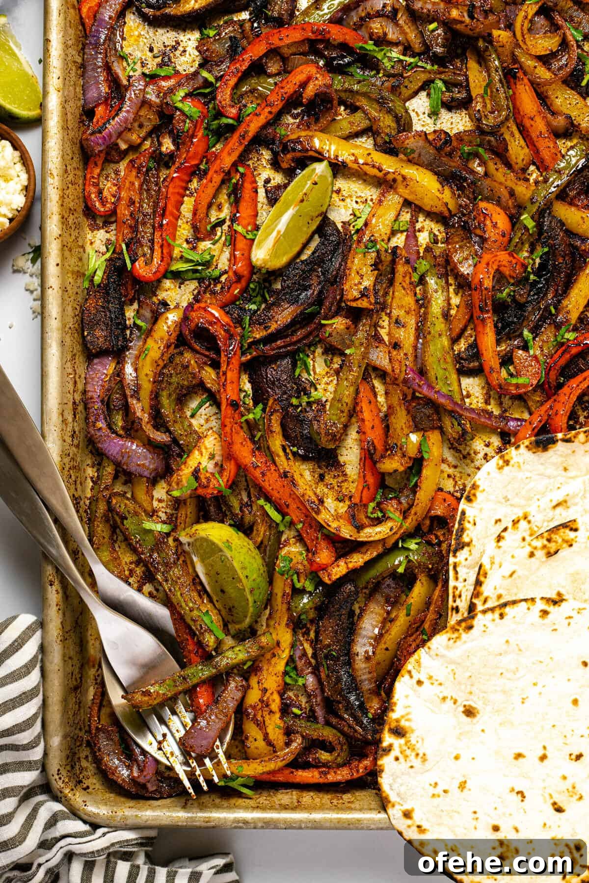 Oven-Baked Fajita Vegetables with Bell Peppers and Onions 10 Baking sheet filled with oven baked fajita veggies