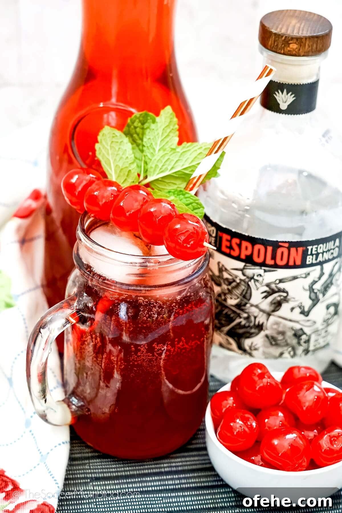 Tipsy Texan Cocktail Recipe: How to Make the Signature Texan Drink 2 tequila and cranberry cocktail in a mason jar mug