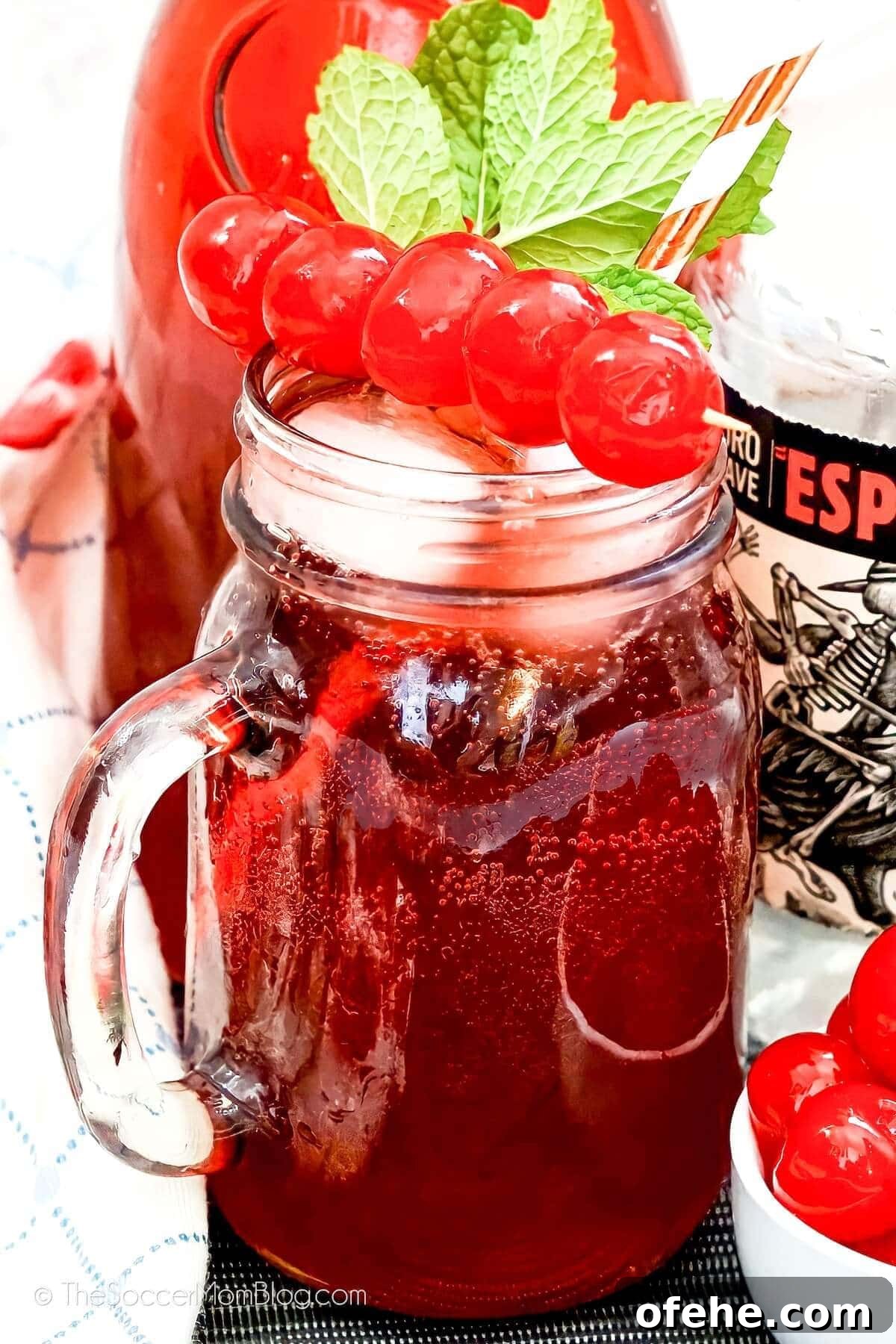 Tipsy Texan Cocktail Recipe: How to Make the Signature Texan Drink 3 Tipsy Texan - tequila cranberry cocktail in a mason jar mug