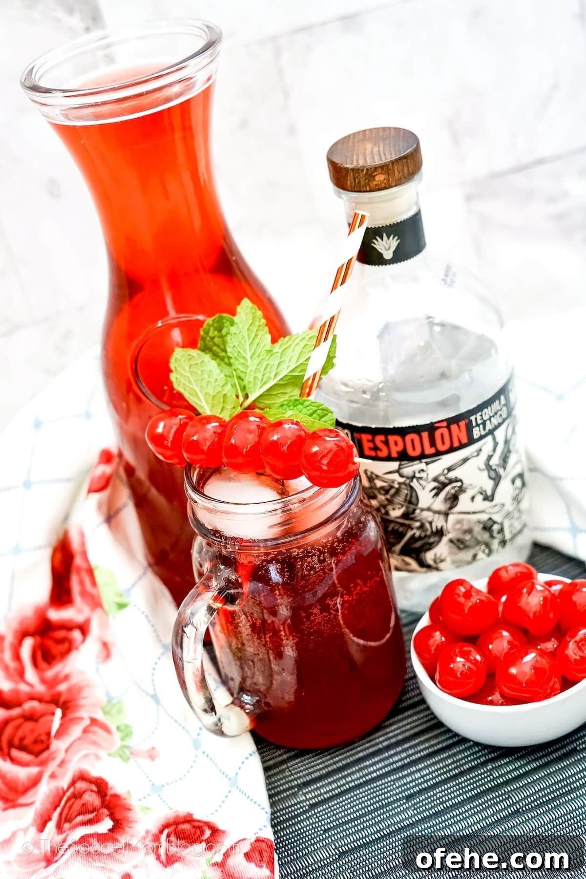Tipsy Texan Cocktail Recipe: How to Make the Signature Texan Drink 6 bright red tequila cocktail in mason jar