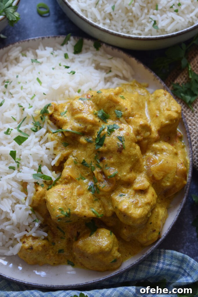 Creamy Chicken Masala Recipe: Rich, Spiced Indian Curry 5 Chicken Masala on a plate with basmati rice.