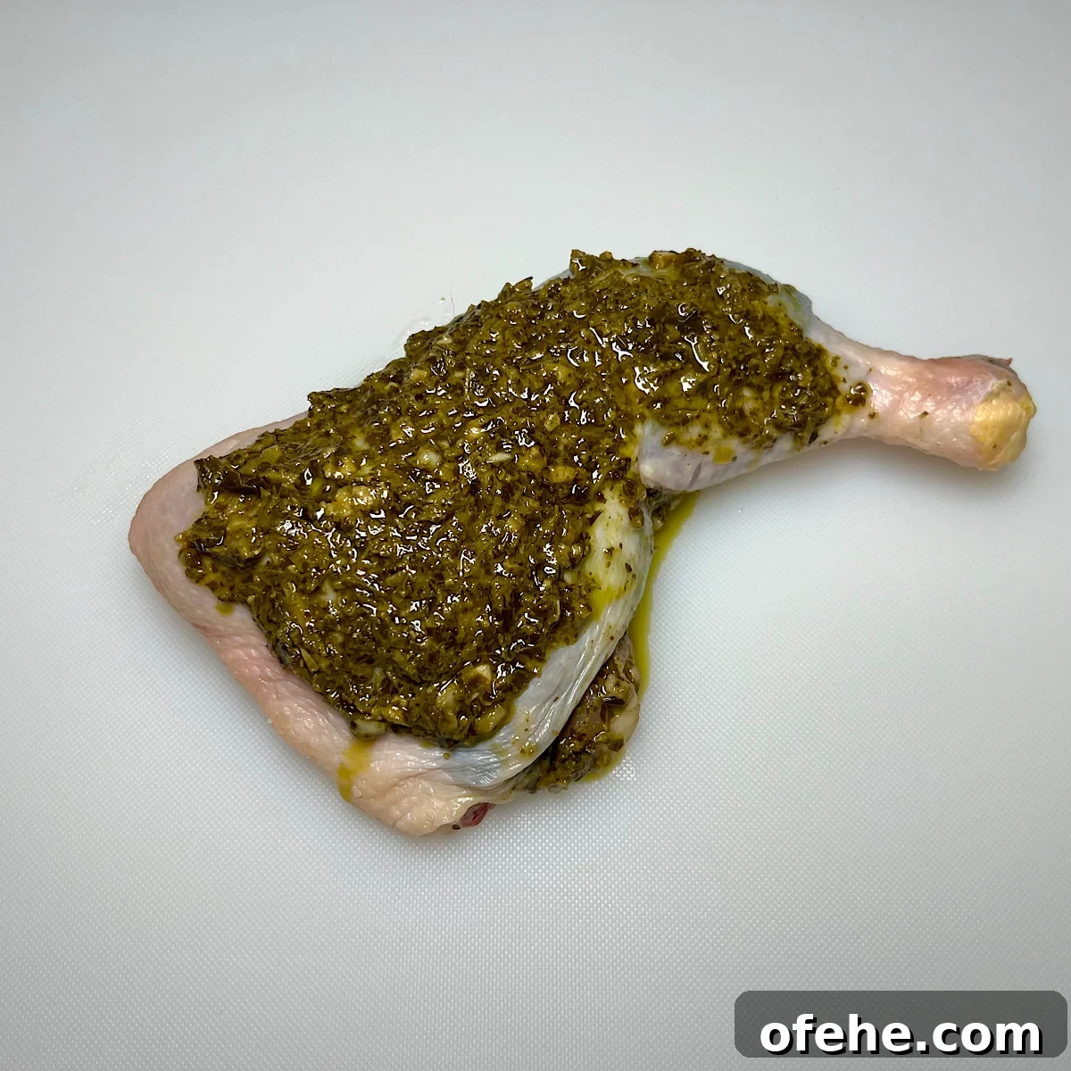 Grilled Chicken Leg Quarters with Basil Pesto Sauce 7 chicken leg quarter with pesto on top