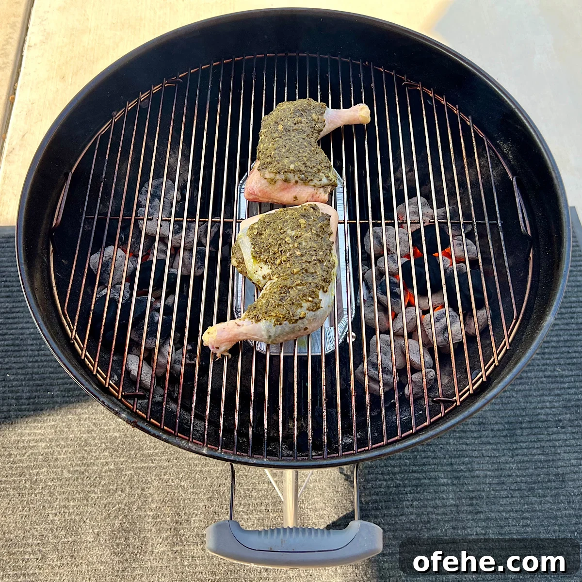 Grilled Chicken Leg Quarters with Basil Pesto Sauce 8 raw pesto chicken on grill grate