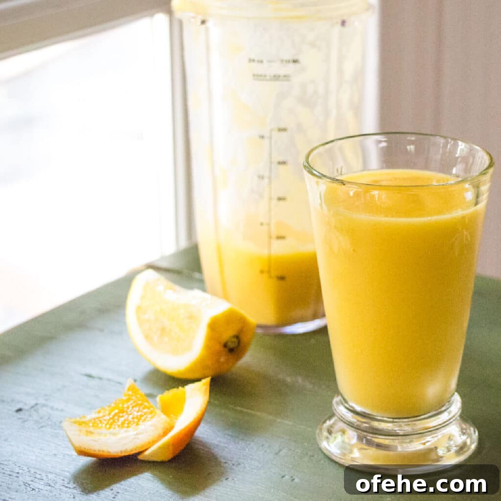 A glass of orange mango smoothie.
