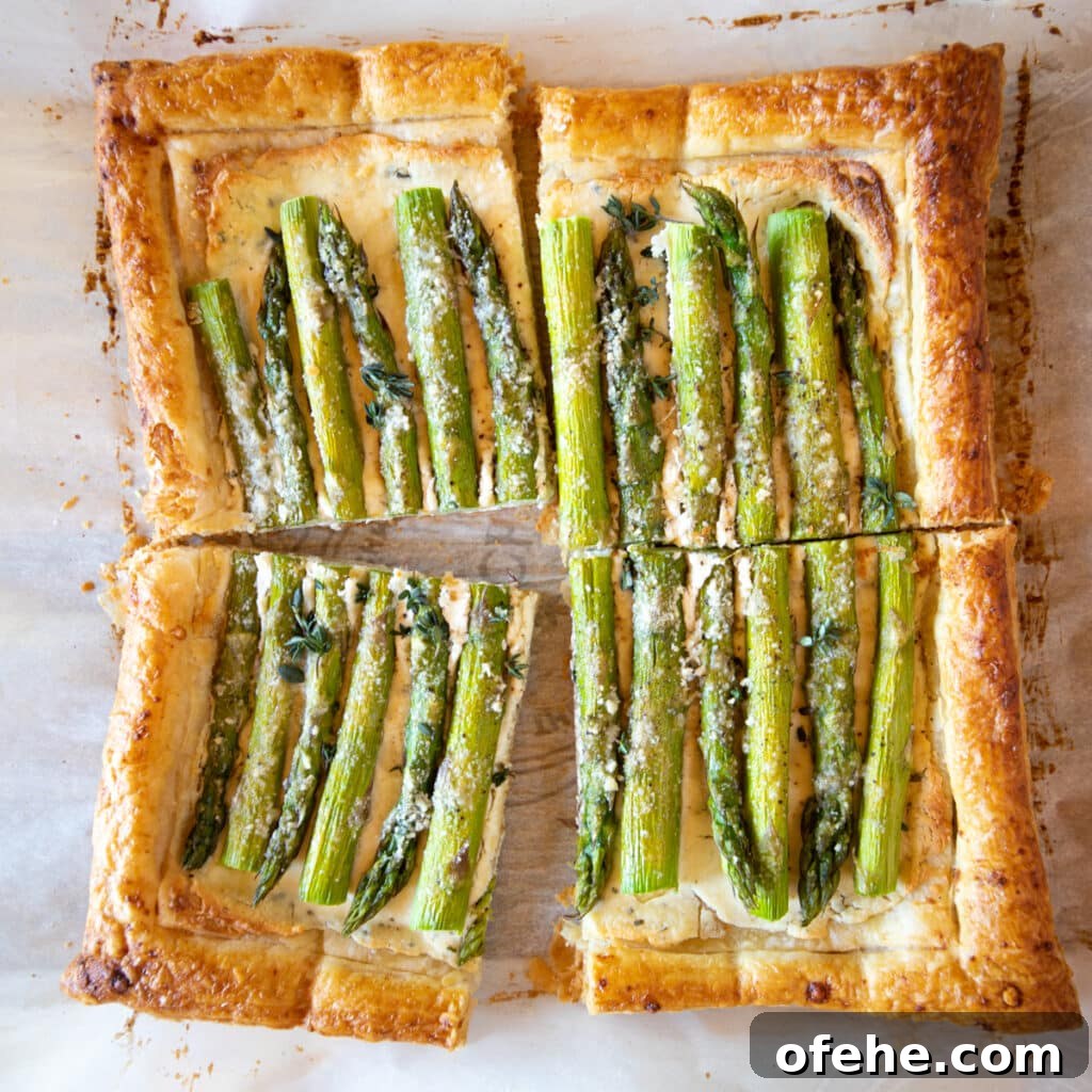 Asparagus tart baked in puff pastry with cheese.