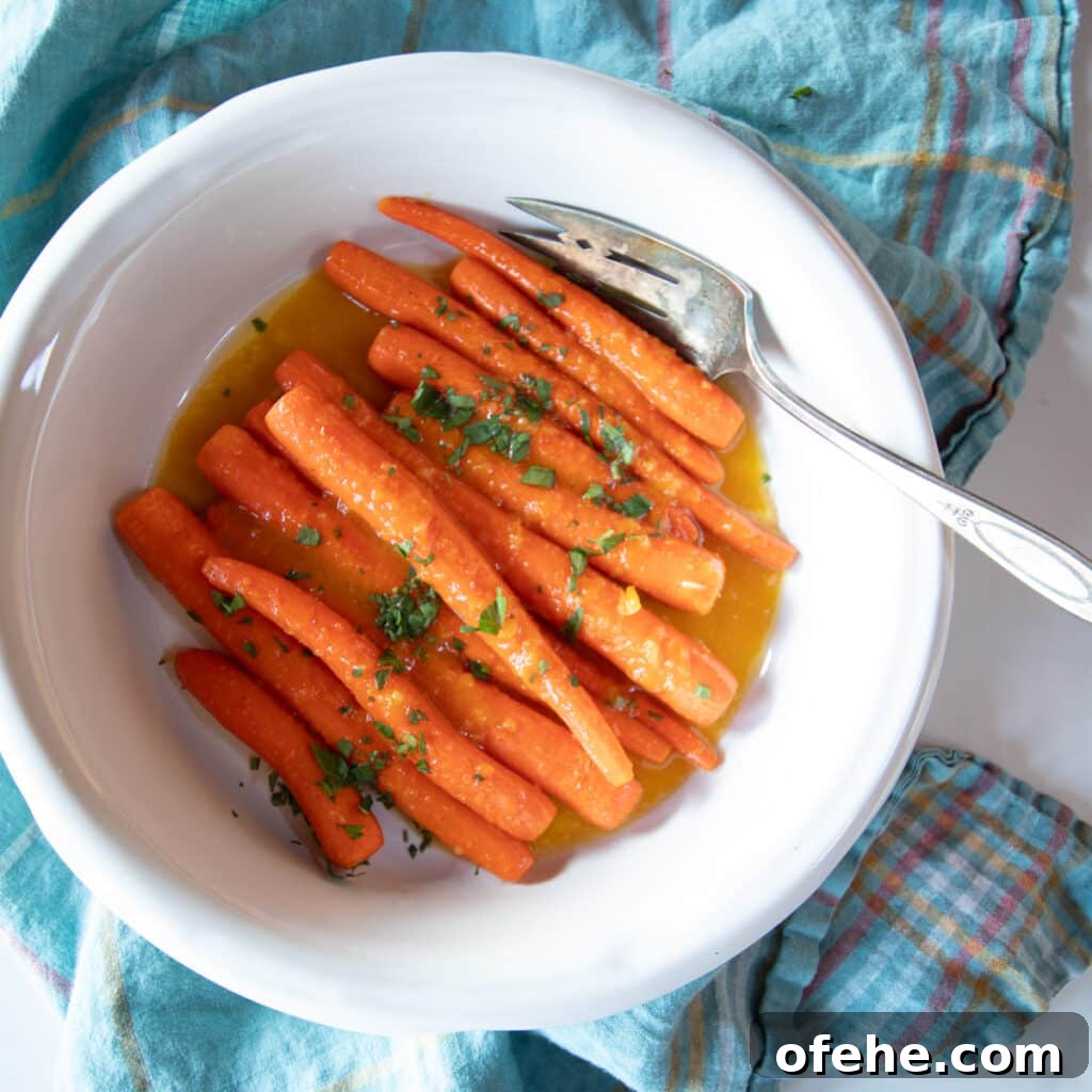 Braised citrus ginger carrots on a serving dish.
