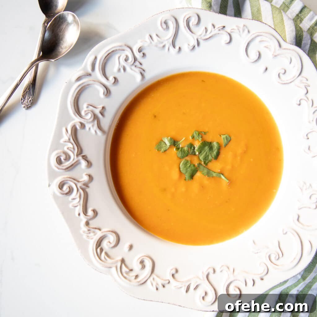 Carrot coconut and ginger soup in a bowl.