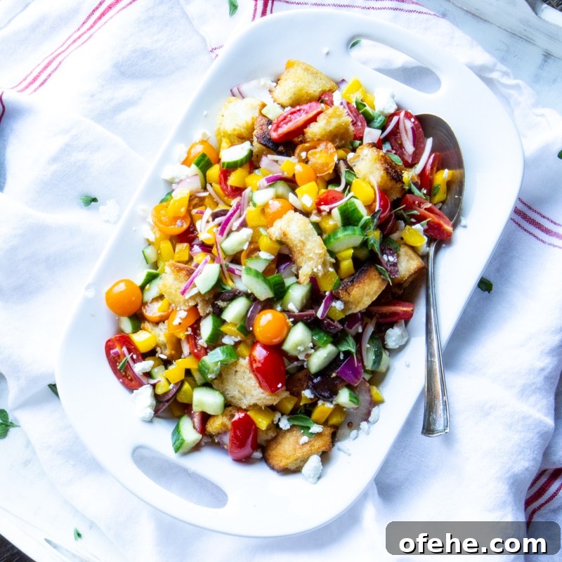 Loaded Greek salad with cucumbers and tomatoes.